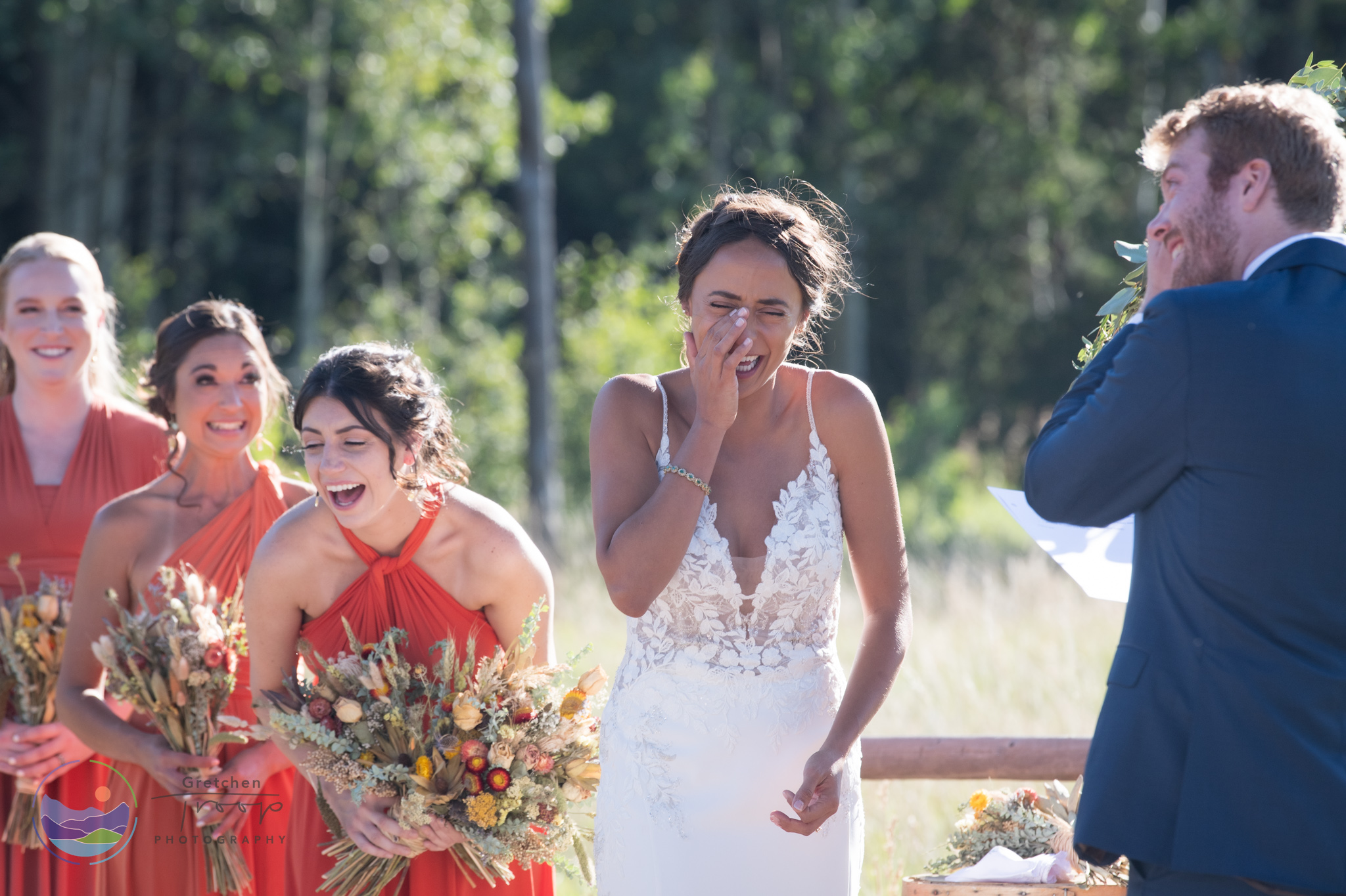 Everyone shares a laugh during the wedding ceremony at Wild Basin Lodge in Estes Park, Colorado