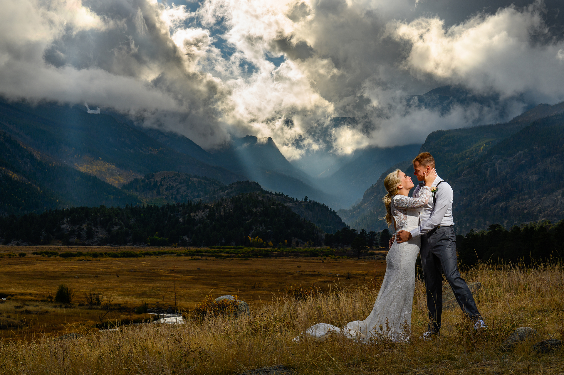 A couple embraces on their wedding day in Rocky Mountain National Park
