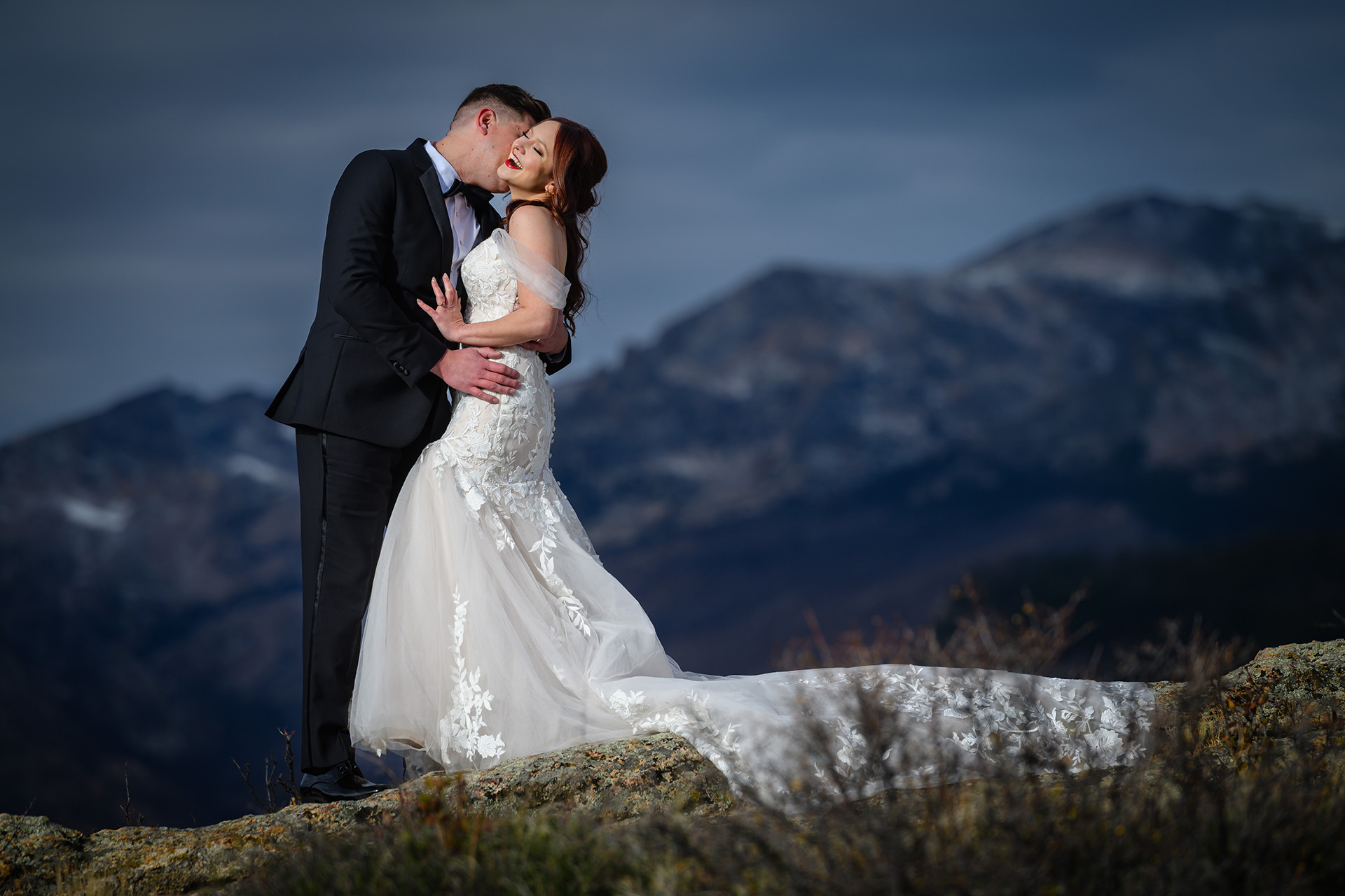 Wedding couple embracing in the mountains of Colorado at Rocky Mountain National Park
