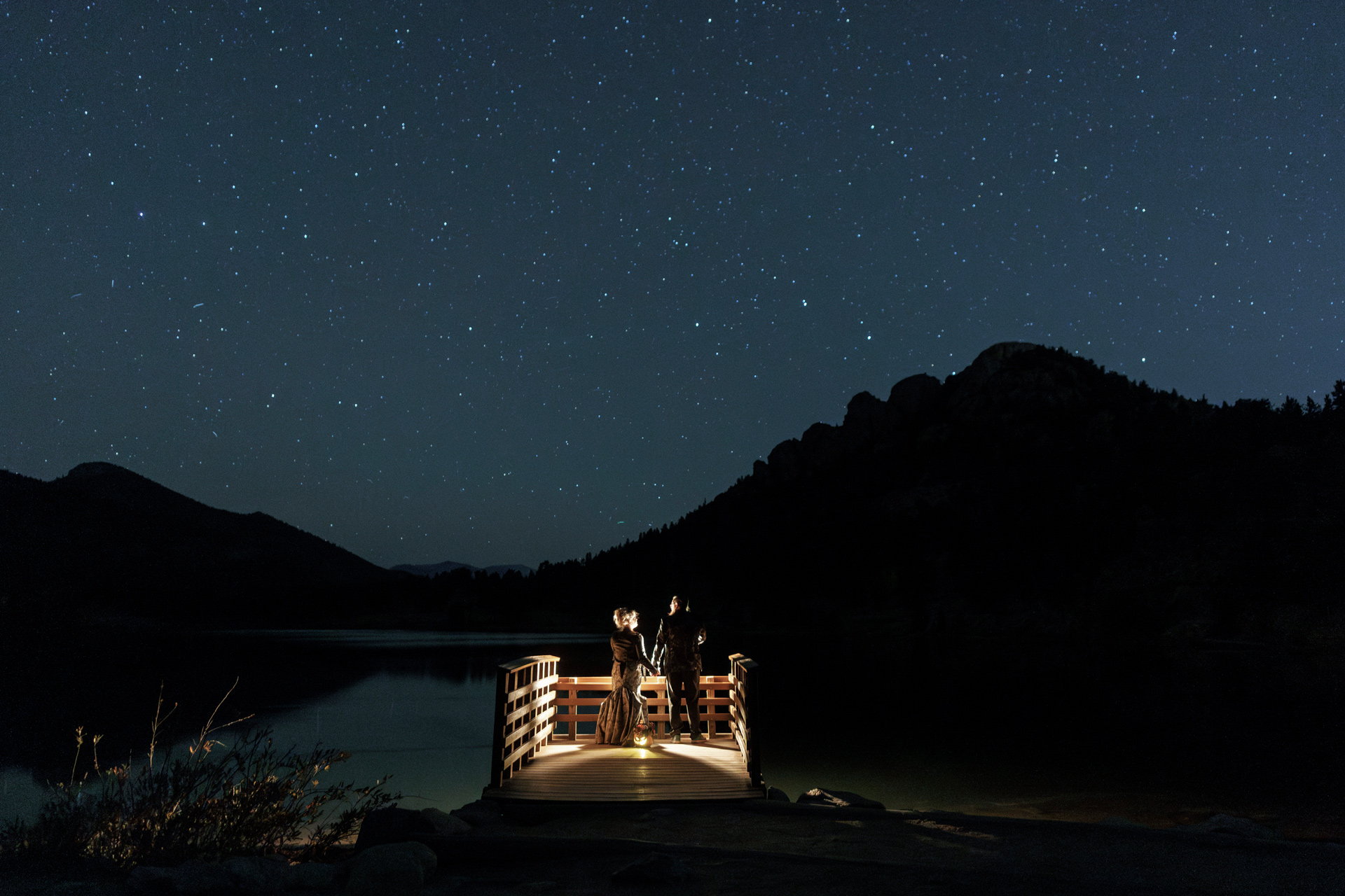 A wedding couple under the night stars in Rocky Mountain National Park, Colorado
