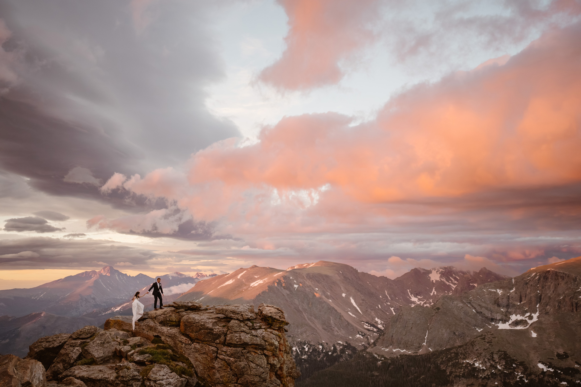 Wedding Couple Climbs to the top of the mountains in Rocky Mountain National Park