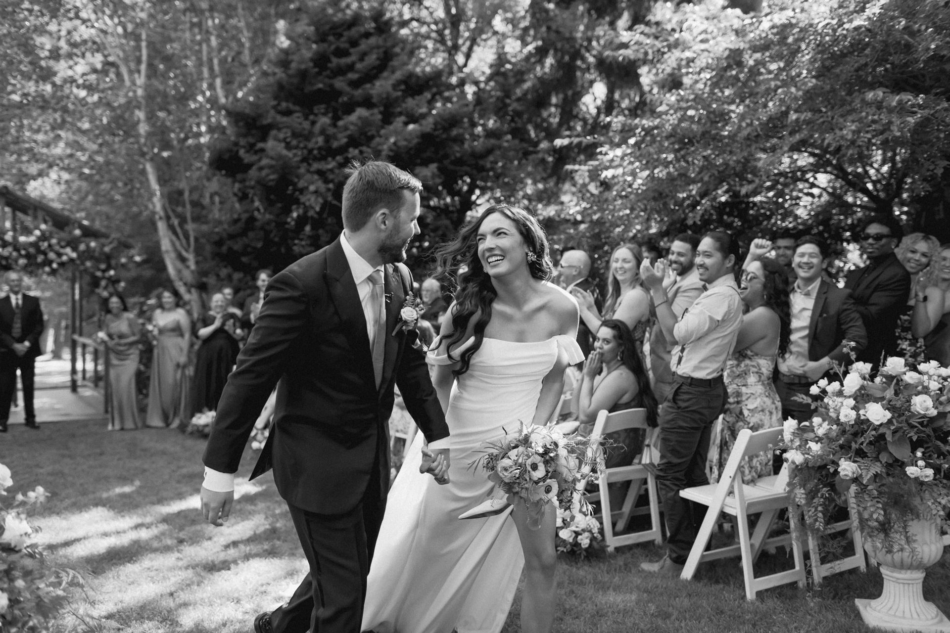 Wedding couple smiles joyously at each other in Rocky Mountain National Park