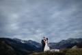 Couple perched high in the mountains of Rocky Mountain Park just outside Estes Park, Colorado